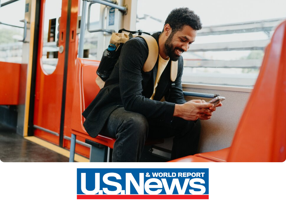 Stock Image of a person smiling to their phone on public transportation.