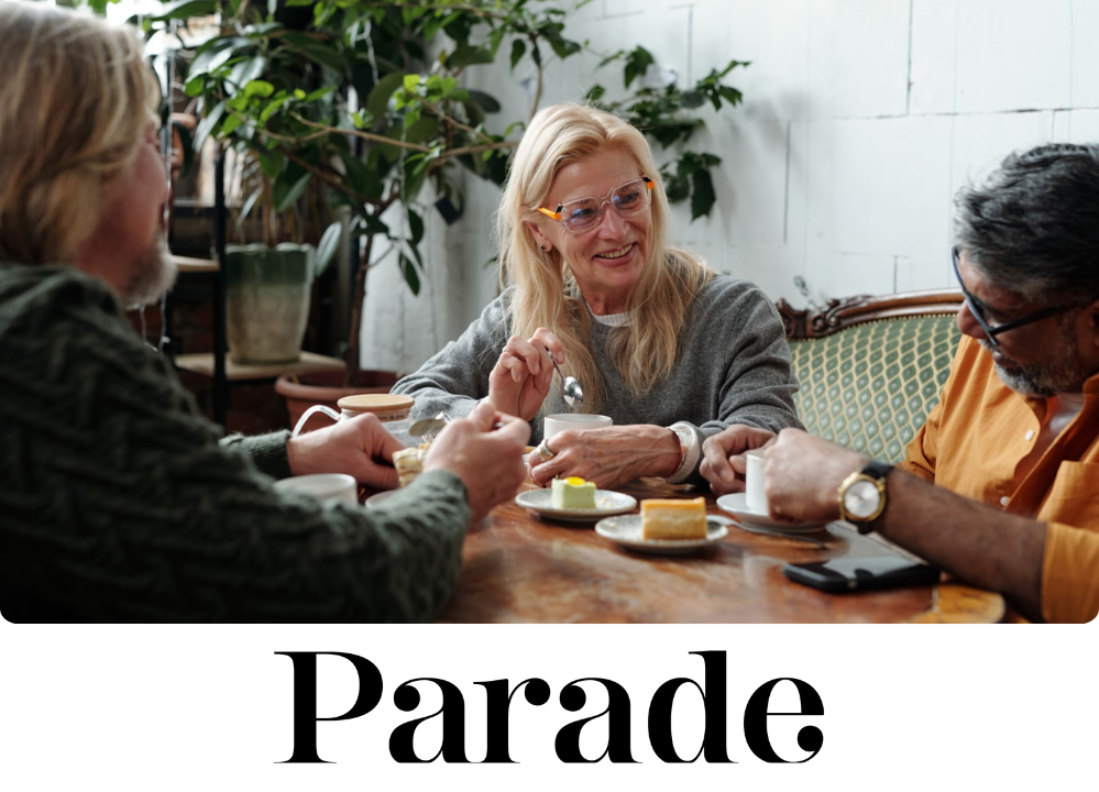 Stock Image of 3 people having tea and dessert, seemingly at a cafe.