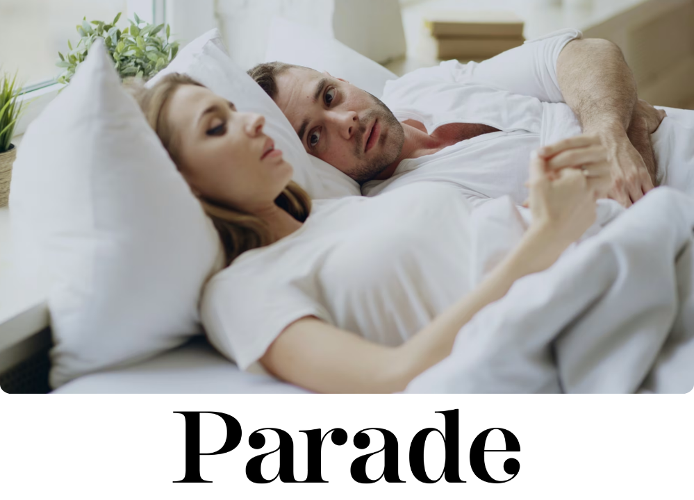 Stock Image of a couple laying in bed.